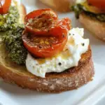 Pesto Burrata Crostini with Roasted Tomatoes Recipe