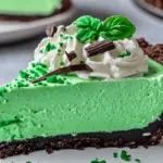 Shamrock Crème Pie with a chocolate crust, mint filling, whipped cream, and festive sprinkles