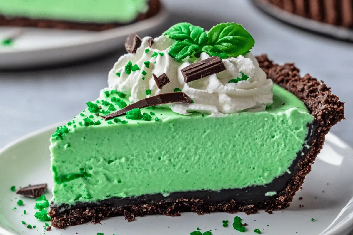 Shamrock Crème Pie with a chocolate crust, mint filling, whipped cream, and festive sprinkles