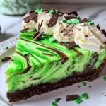 Shamrock Swirl Pie with chocolate crust, green mint filling, and chocolate swirls, topped with whipped cream