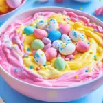 A pastel-colored Easter Dip with sprinkles served with cookies and fruit