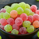A bowl of colorful Sour Patch Grapes coated in fruity Jell-O powder