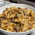 Creamy Parmesan Garlic Beef Bowtie Pasta, with tender beef, a creamy sauce, and perfectly cooked bowtie pasta garnished with parsley.
