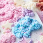 Colourful homemade cloud dough with glitter and beads, perfect for sensory play.